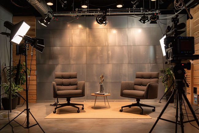 Studio Intgration The interior of a studio is set up for podcasting and interviews ...